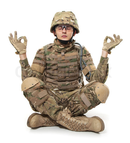 Modern soldier meditating. Isolated on a white background
